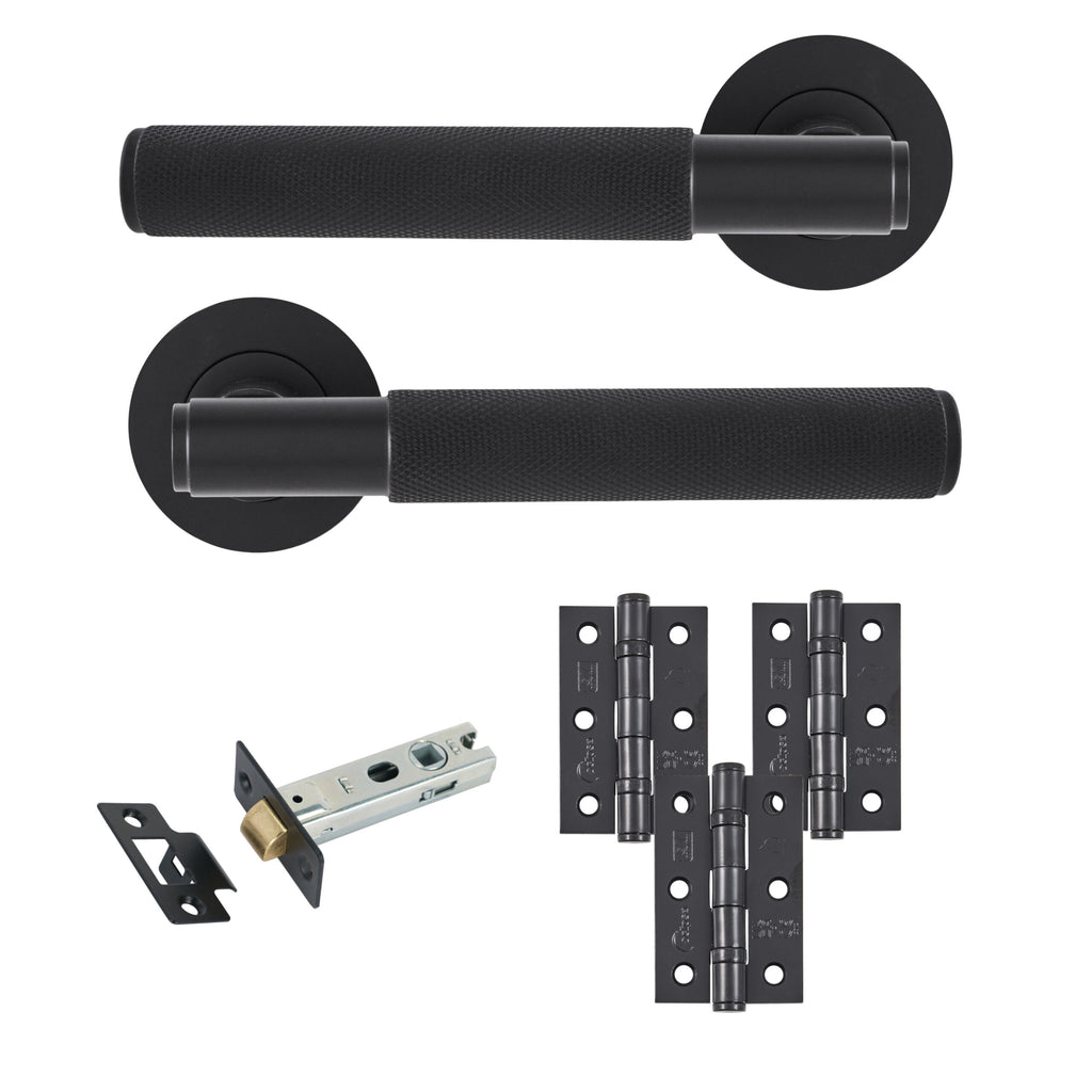 Matt black knurled lever door handle set with round rose backplates, three black door hinges, tubular latch and matching strike plate for internal doors.