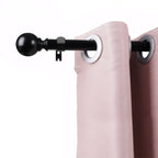 Black metal curtain rod with a round ball finial, adjustable telescoping rod, and wall-mount bracket on a white background.