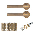 Antique brass knurled lever door handle set with round rose backplates, three matching brass door hinges, tubular latch, strike plate and fixing screws for internal doors.