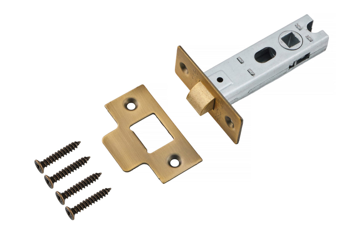Antique brass knurled lever door handle set with round rose backplates, three matching brass door hinges, tubular latch, strike plate and fixing screws for internal doors.